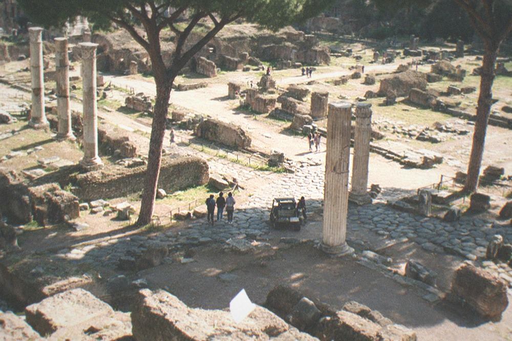 The Roman Forum ruins with columns and ancient paving stones