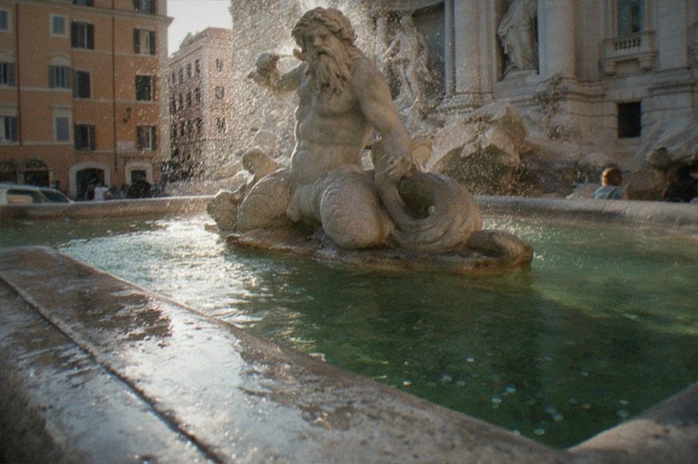 The carved Oceanus statue at the centre of the Trevi Fountain seen from below